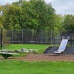 Wooden swings and mound slide at Princes Park Playground Wooden swings and mound slide at Princes Park Playground